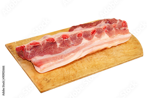 Raw pork ribs on wooden cutting board.Isolated.