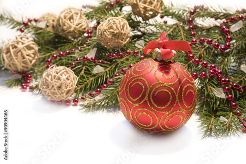 Christmas red ball, twig of fir , red beads