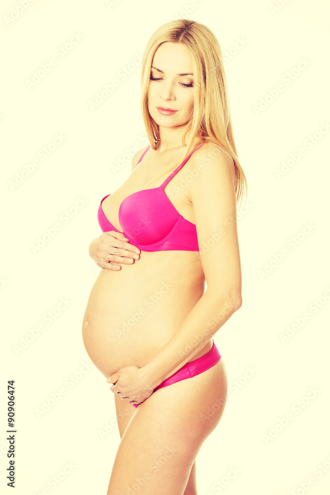 Smiling pregnant woman in lingerie Smiling pregnant woman in lingerie