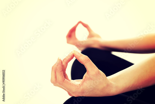 Woman hands in ohm yoga pose