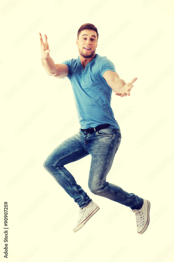 Handsome man jumping for joy.