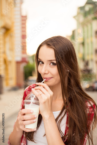 beautiful girl drinking a milkshake