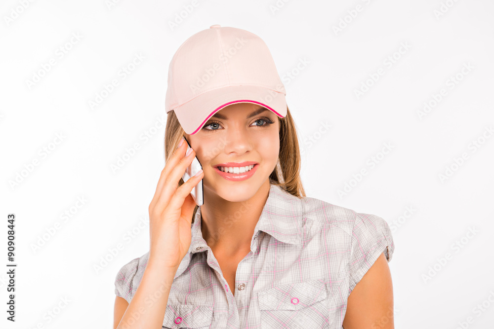 cute young woman with cap talking on the phone cute young woman with cap talking on the phone