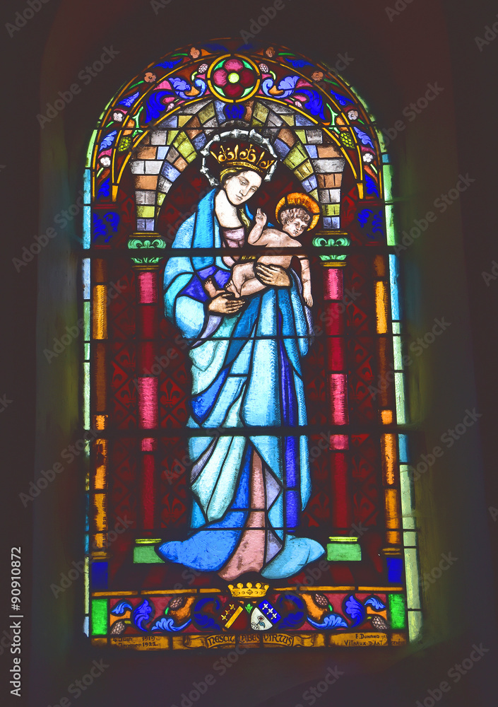 Stained glass window depiction of Mary and the Christ child.