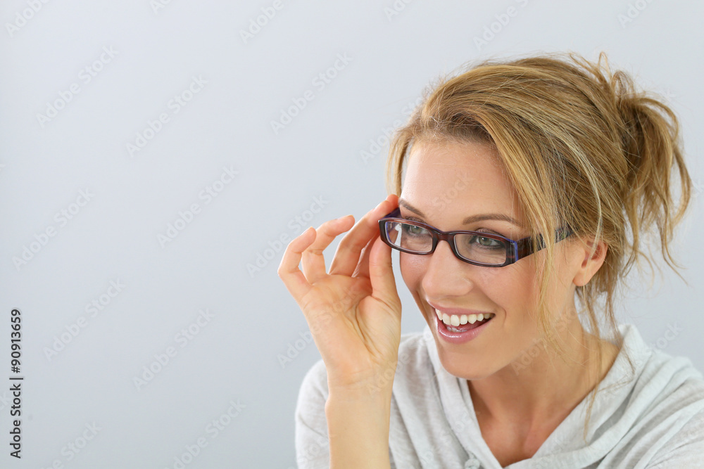 Portrait of smiling blind woman with eyeglasses, isolated