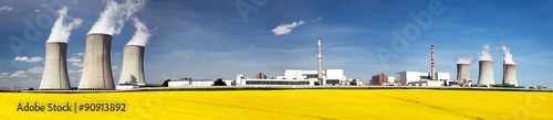 Nuclear power plant Dukovany with golden glowering field photo