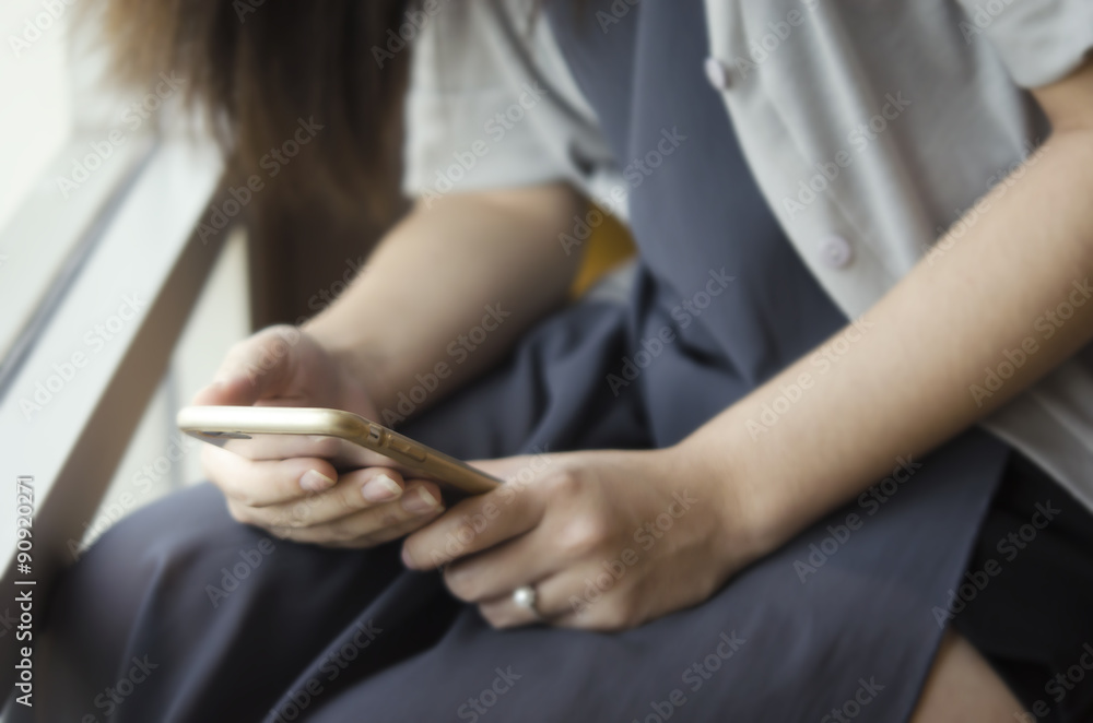 Fototapeta premium Girl obsesses with her phone - Typical behavior of modern girls