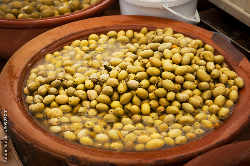 Different marinated olives and local food on spanish street mark Different marinated olives and local food on spanish street mark