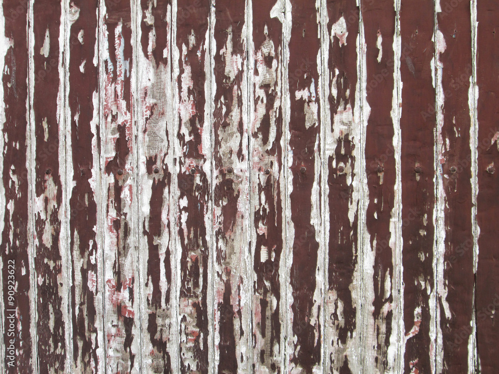 Old brown paint coming off wooden boards Old brown paint coming off wooden boards