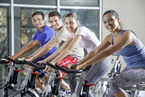 group of 4 cycling at gym © Dan Kosmayer