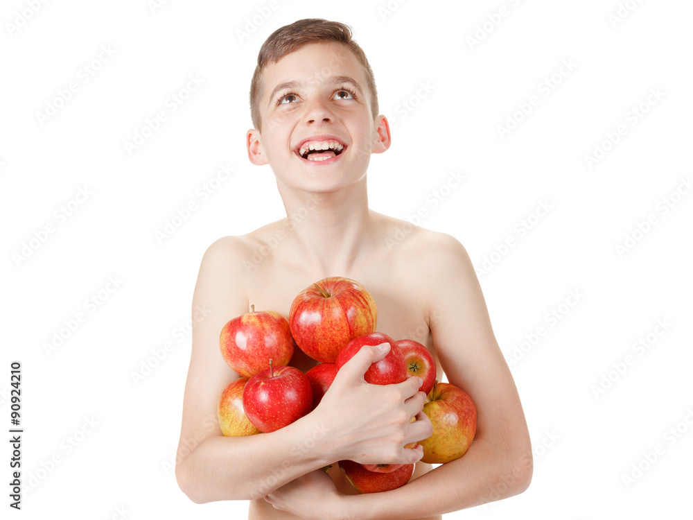 Smiling boy with a pile of apples Smiling boy with a pile of apples