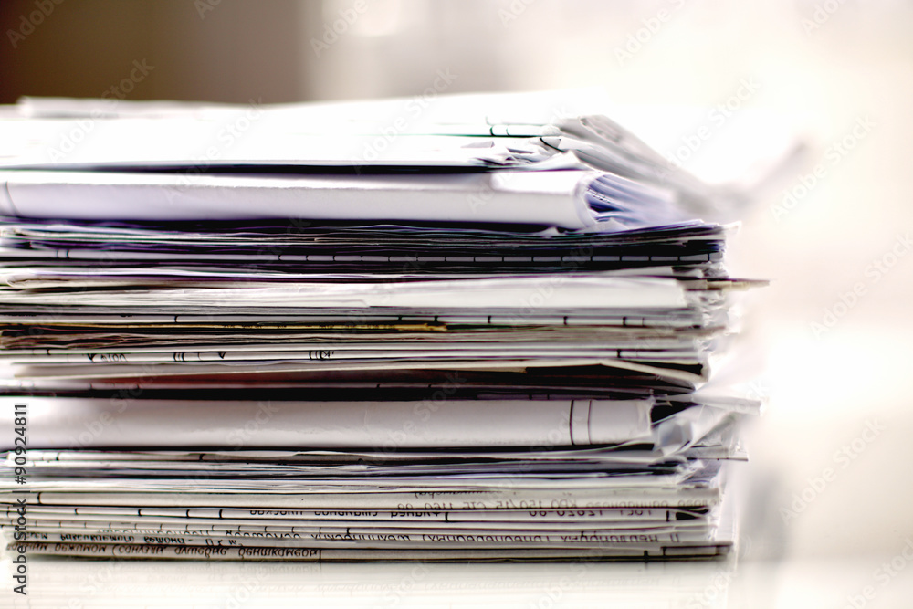 Big stack of papers ,documents on the desk Big stack of papers ,documents on the desk