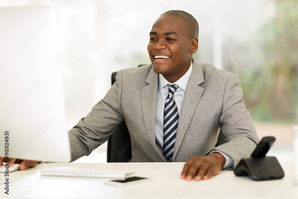 young african businessman working on computer young african businessman working on computer