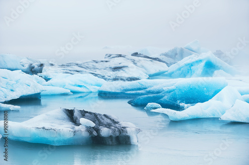Beautiful blue icebergs in Jokulsarlon glacial lagoon, Iceland © smallredgirl