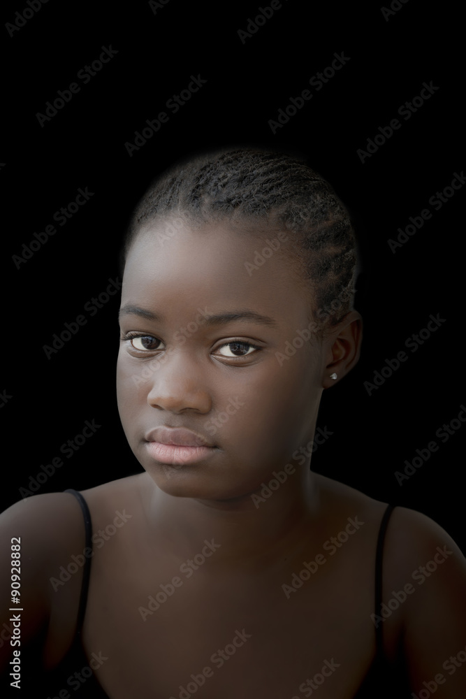 Low key portrait of an Afro girl, twelve years old Low key portrait of an Afro girl, twelve years old
