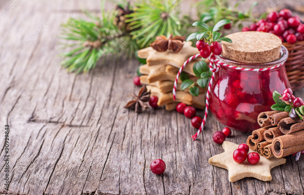 Cranberry sauce in a glass on wooden board Cranberry sauce in a glass on wooden board