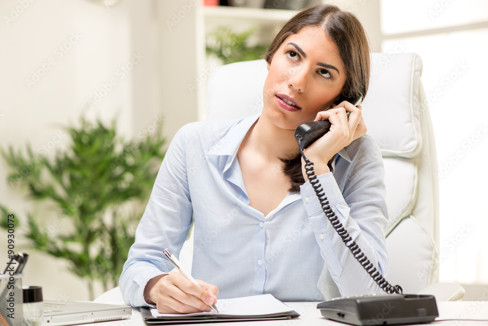 Businesswoman Phoning In The Office Businesswoman Phoning In The Office