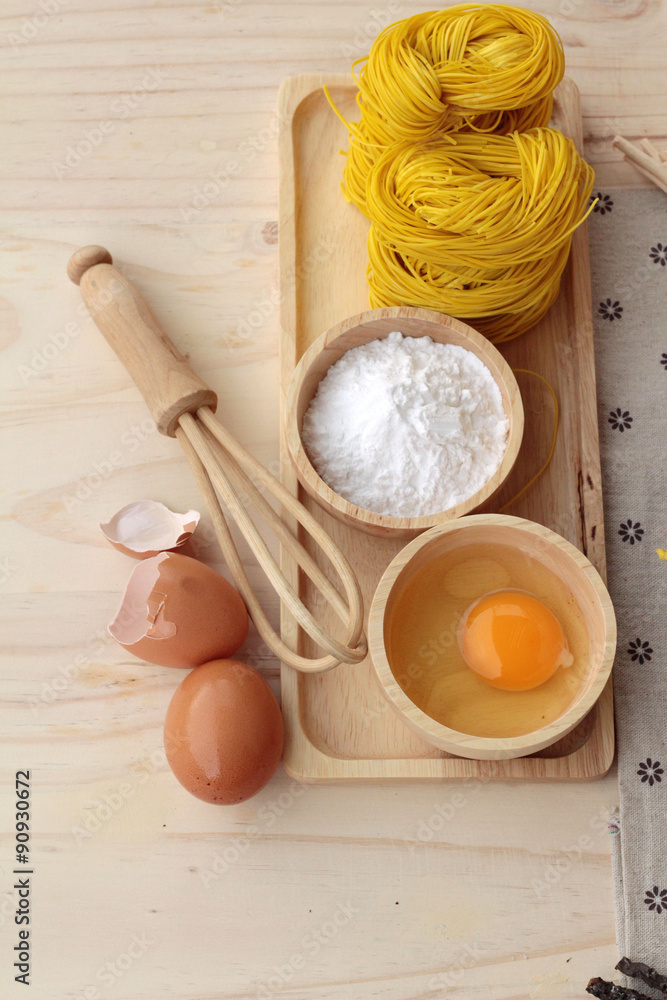 Making yellow noodle with egg and wheat flour. Making yellow noodle with egg and wheat flour.