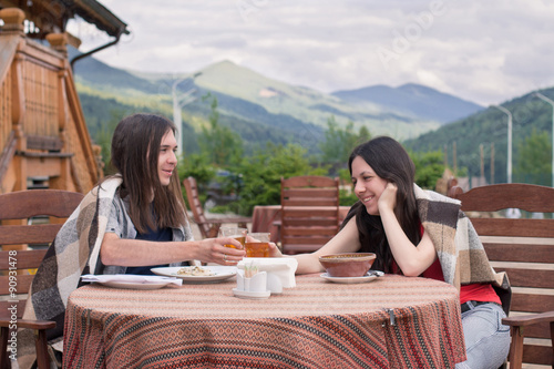 Loving couple eating in Carpathian Mountains