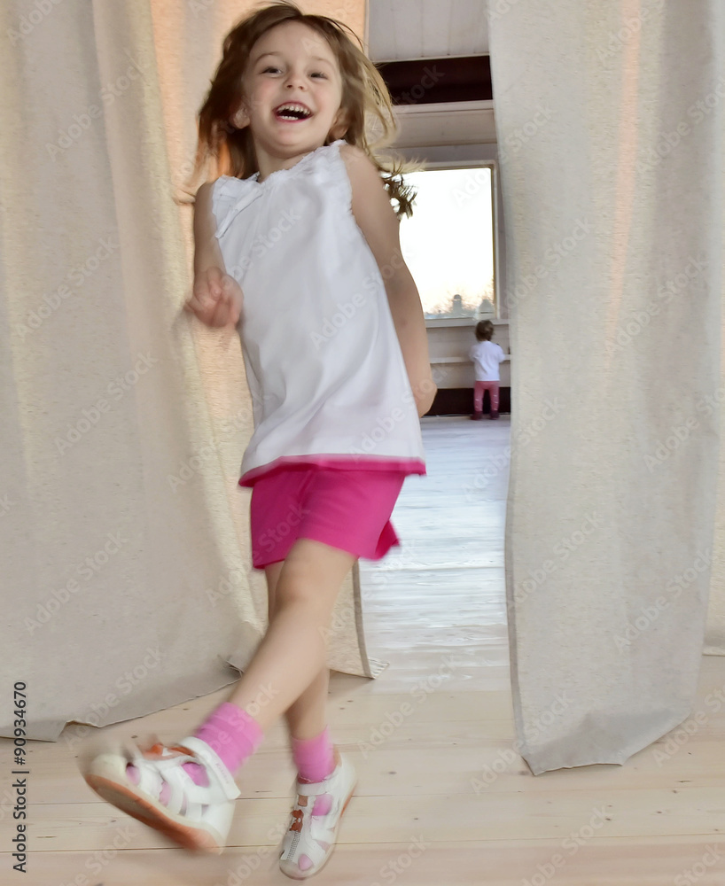 Happy smiling little girls in red pants
Happy smiling little girls in red pants