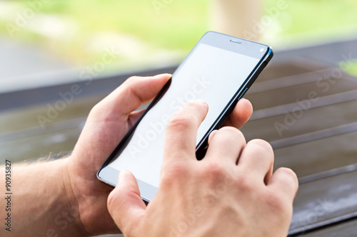 Man using his Mobile Phone outdoor