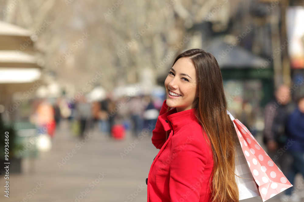 Shopper woman shopping in the street in winter