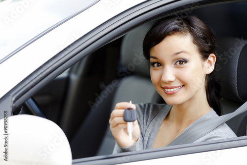 Wallpaper Mural Pretty girl in a car showing the key Torontodigital.ca