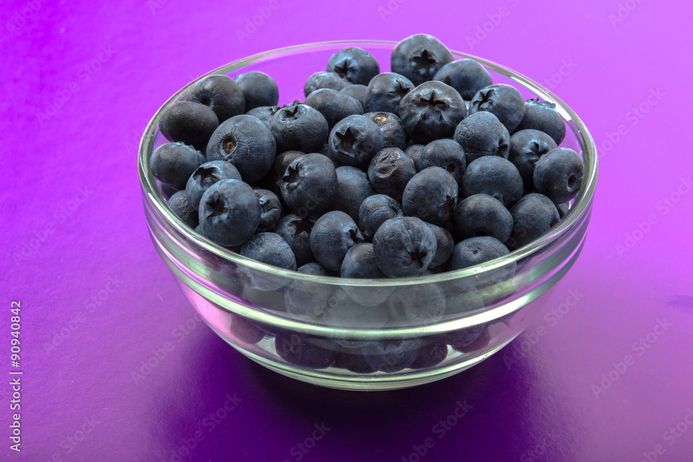 ripe blueberries in bowl isolated on violet ripe blueberries in bowl isolated on violet