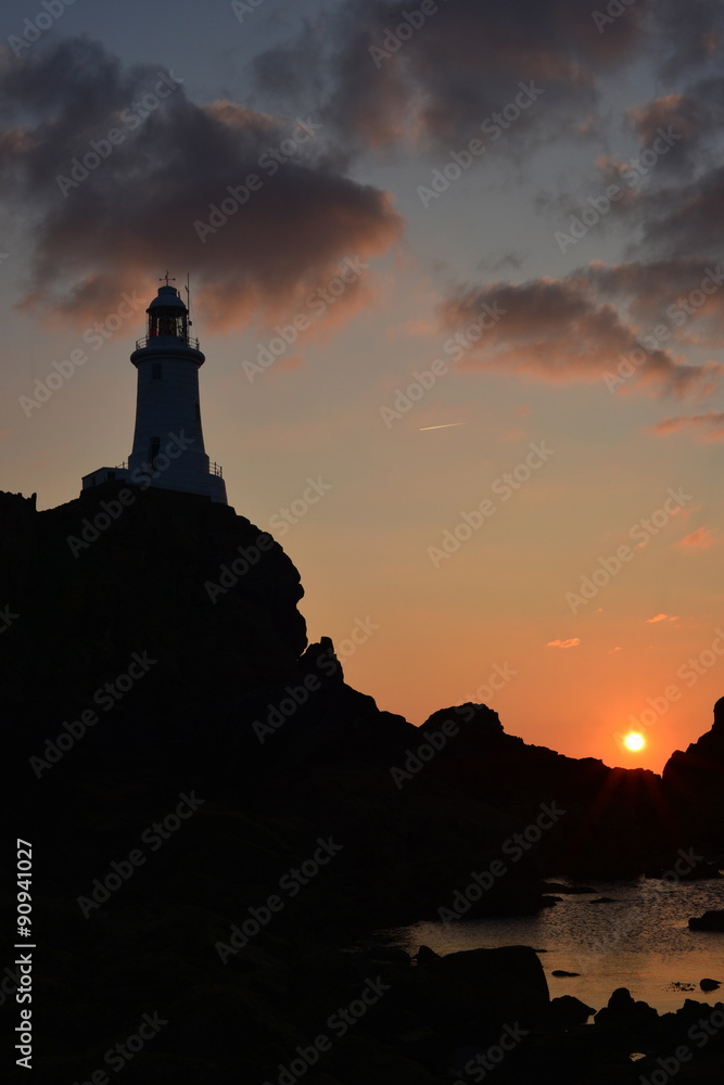 La Corbiere lighthouse, Jersey, U.K.   Coastal landmark at sunset in the Summer.