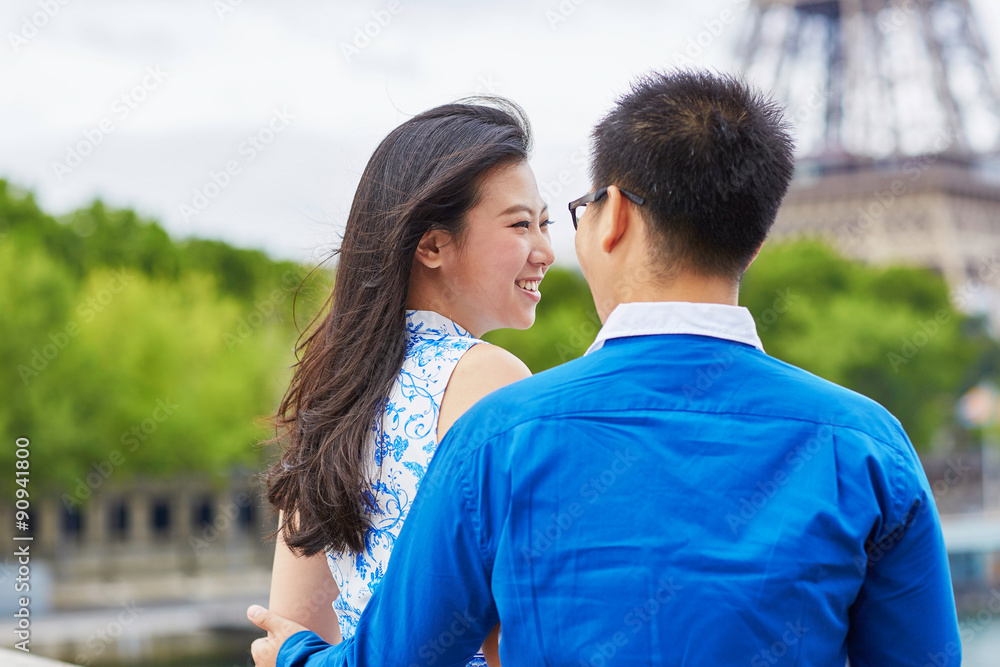 Young romantic Asian couple in Paris, France Young romantic Asian couple in Paris, France