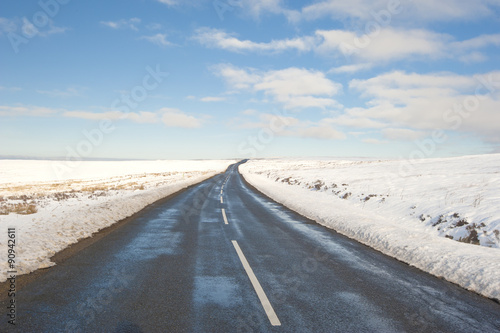 Country road through winter rural scene