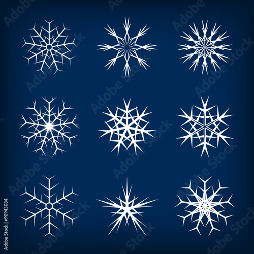 Set of vector snowflakes on dark blue background. 