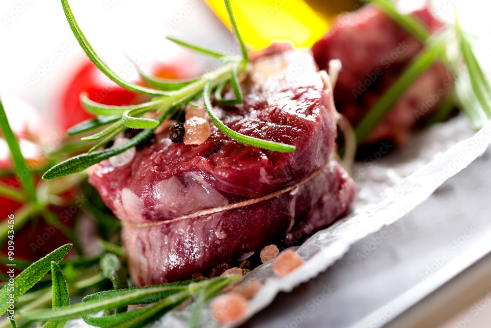 Raw beef steak with peppercorns and herbs Raw beef steak with peppercorns and herbs