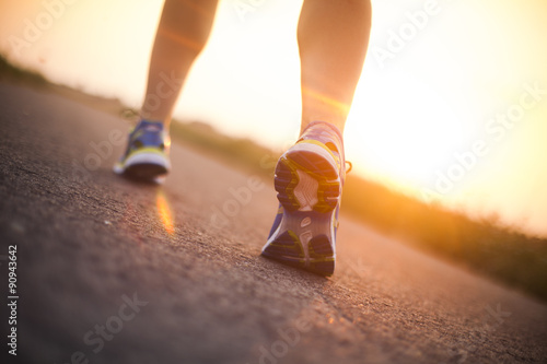 Runner feet running on road closeup on shoe © Sebastian Duda