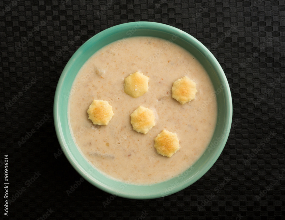 Lobster corn chowder with crackers in bowl Lobster corn chowder with crackers in bowl