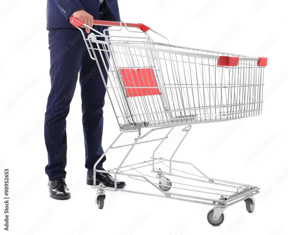 Young man with empty shopping cart, isolated on white