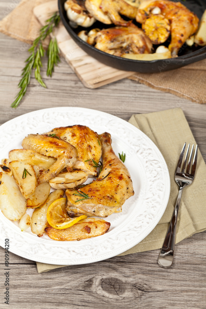 Garlic, Lemon and Rosemary Roasted Chicken. Selective focus. Garlic, Lemon and Rosemary Roasted Chicken. Selective focus.