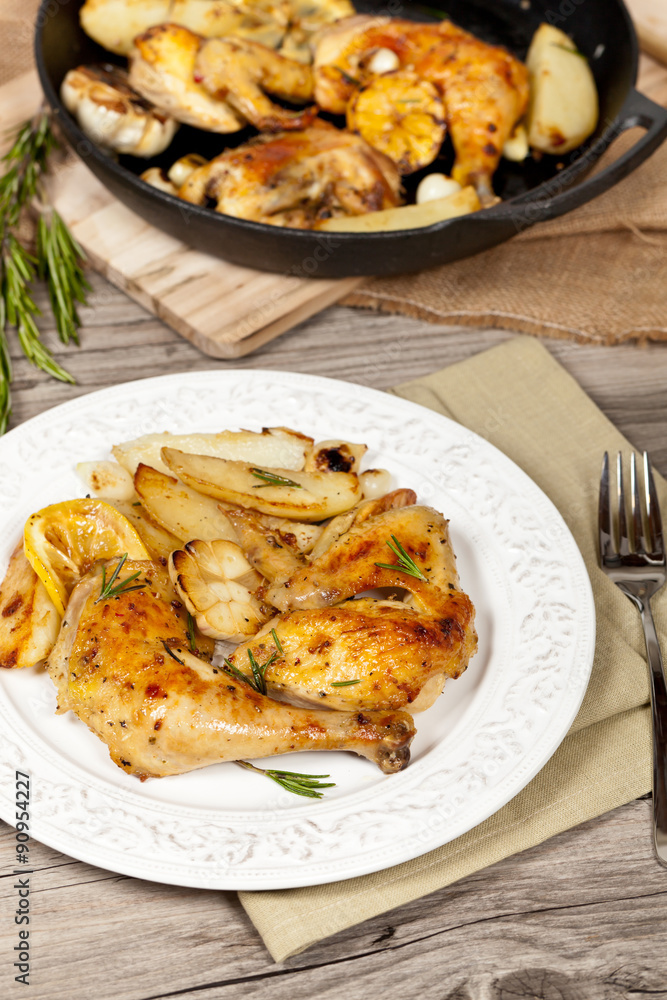 Garlic, Lemon and Rosemary Roasted Chicken. Selective focus. Garlic, Lemon and Rosemary Roasted Chicken. Selective focus.
