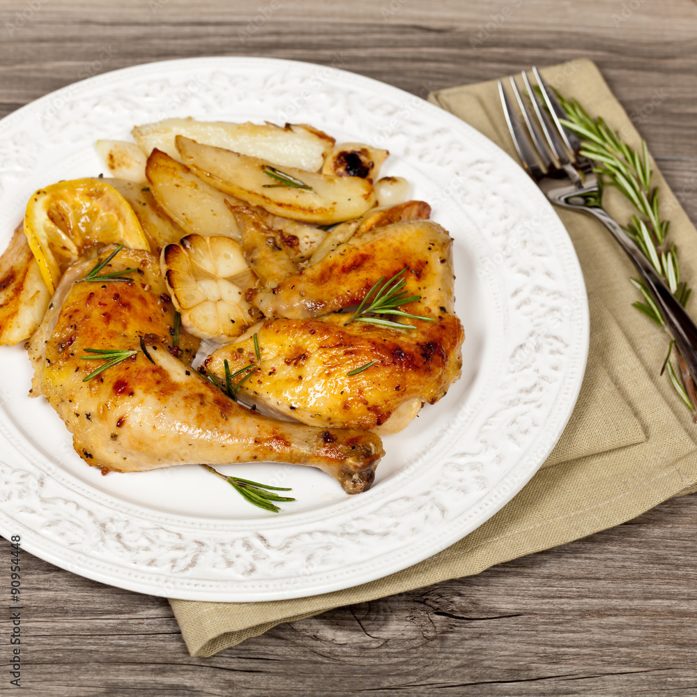 Garlic, Lemon and Rosemary Roasted Chicken. Selective focus. Garlic, Lemon and Rosemary Roasted Chicken. Selective focus.