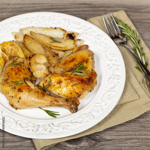 Garlic, Lemon and Rosemary Roasted Chicken. Selective focus.