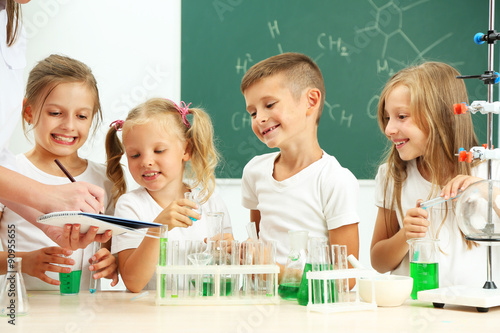Cute pupils with teacher do...