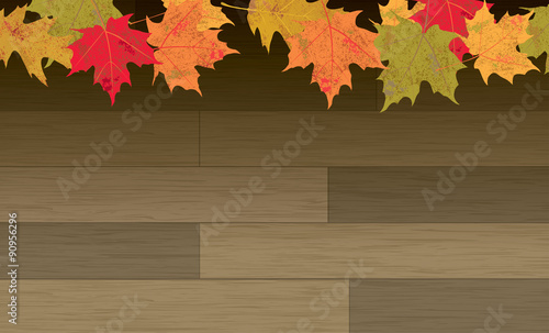 Autumn Leaves on Wood Floor Background