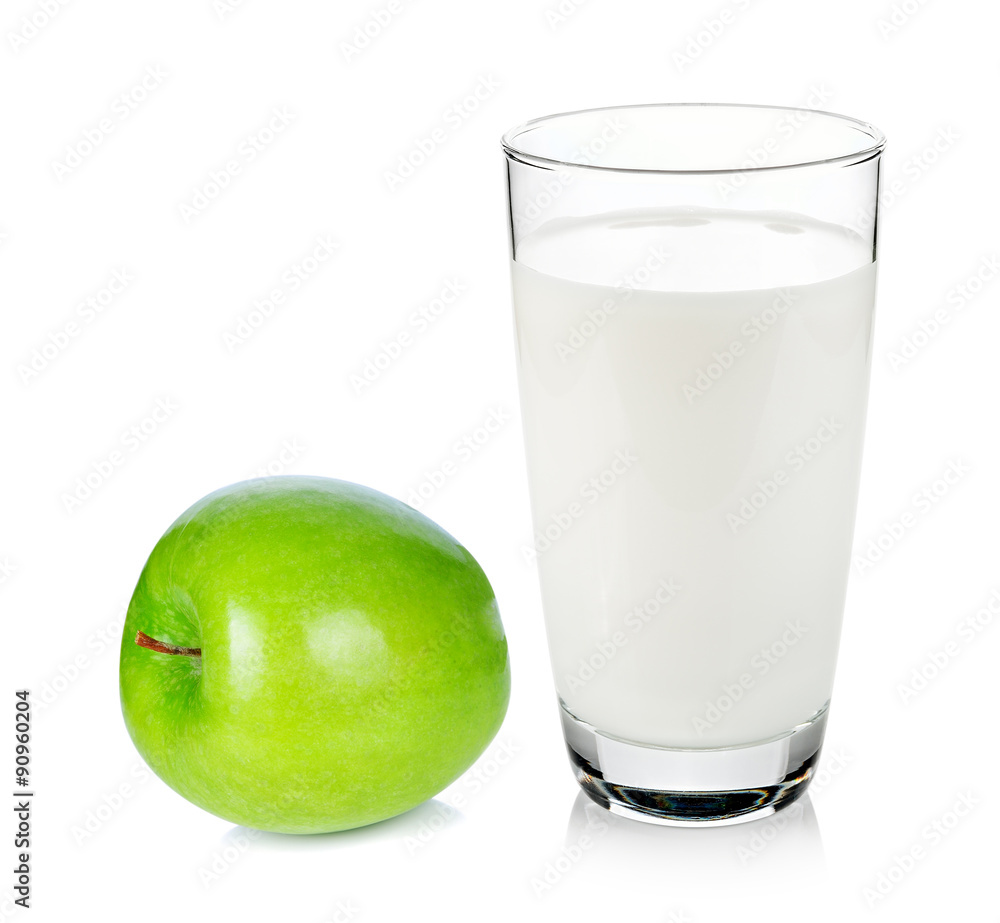 glass of milk and green apple isolated on white background glass of milk and green apple isolated on white background