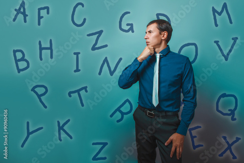 man male teacher businessman thinks alphabet letters looking awa