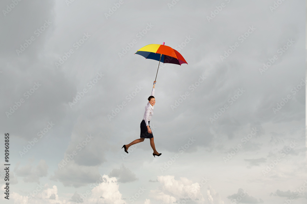 Woman fly on umbrella