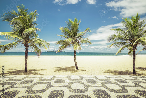 Palms with mosaic on Empty Ipanema Beach in Rio de Janeiro