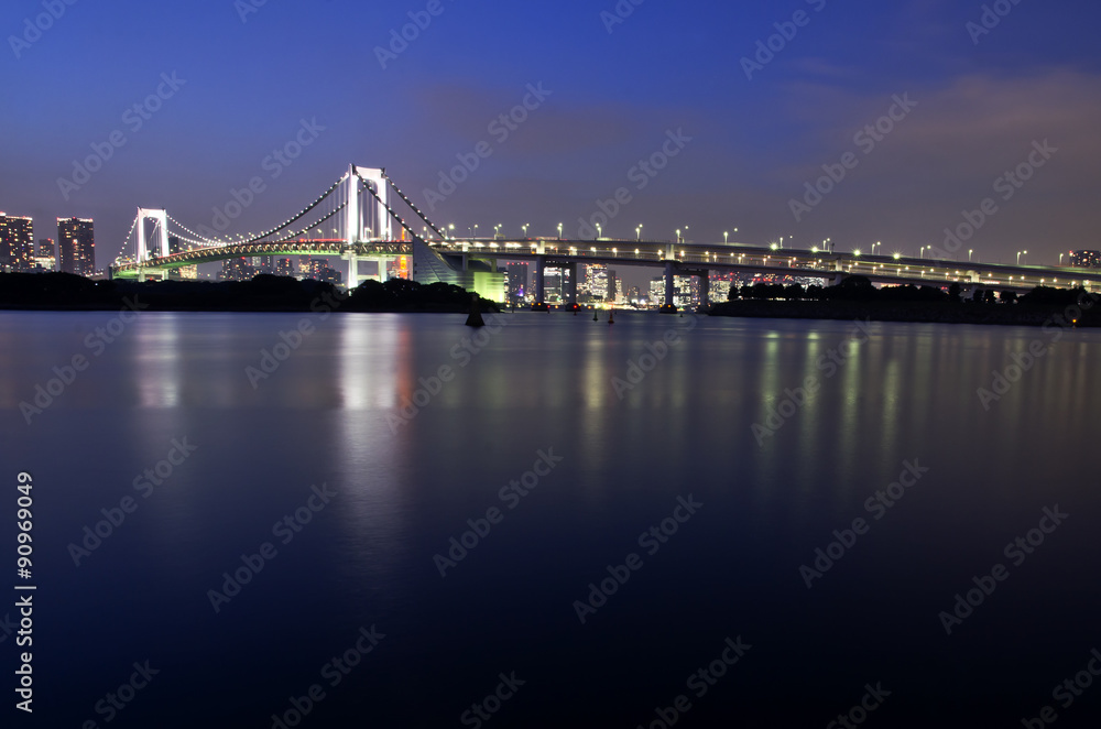 Rainbow bridge night view in Odaiba city, Tokyo japan.