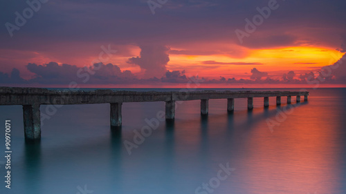 Beautiful sunrise at the sea with stone bridge © namning