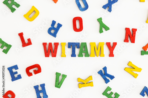 Series "Welcome": word Witamy (welcome in Polish) in wooden letters on white background
