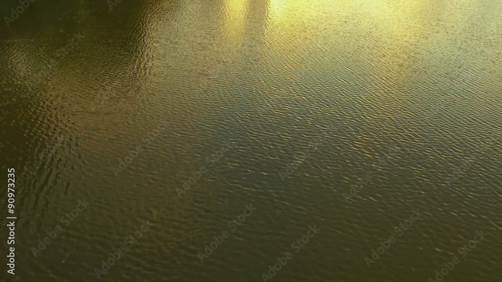 Aerial Shooting of the reflection in the water, a wonderful reflection of the sunset in the lake. Aerial Shooting of the reflection in the water, a wonderful reflection of the sunset in the lake.
